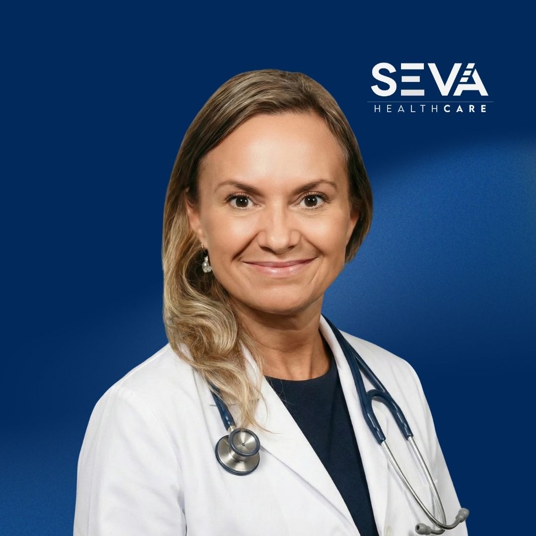 Portrait of a smiling healthcare professional in a white coat with stethoscope on a blue SEVA Healthcare background