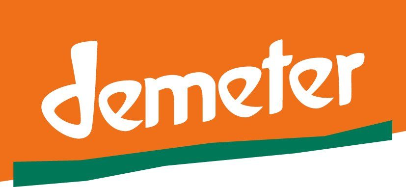Demeter logo in white on an orange background with a green underline