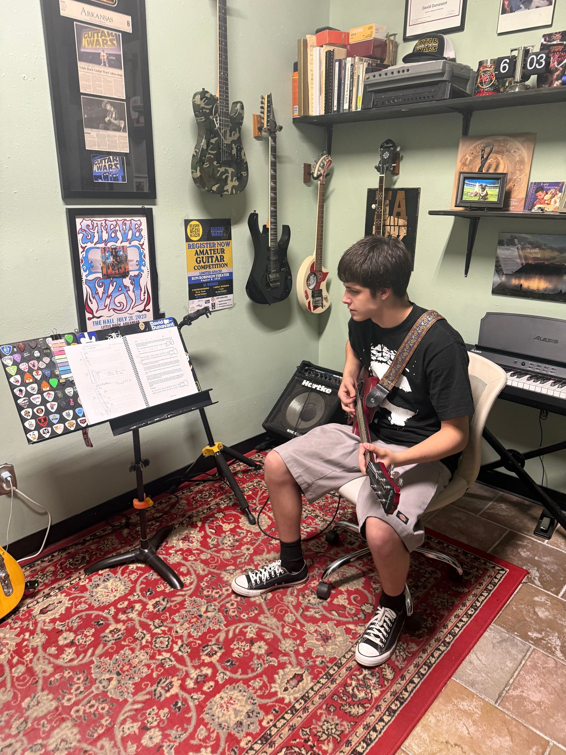 David Dunavant's teaching studio with a student playing the guitar.