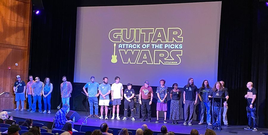 Group of participants on stage at the 2026 Guitar Wars event.