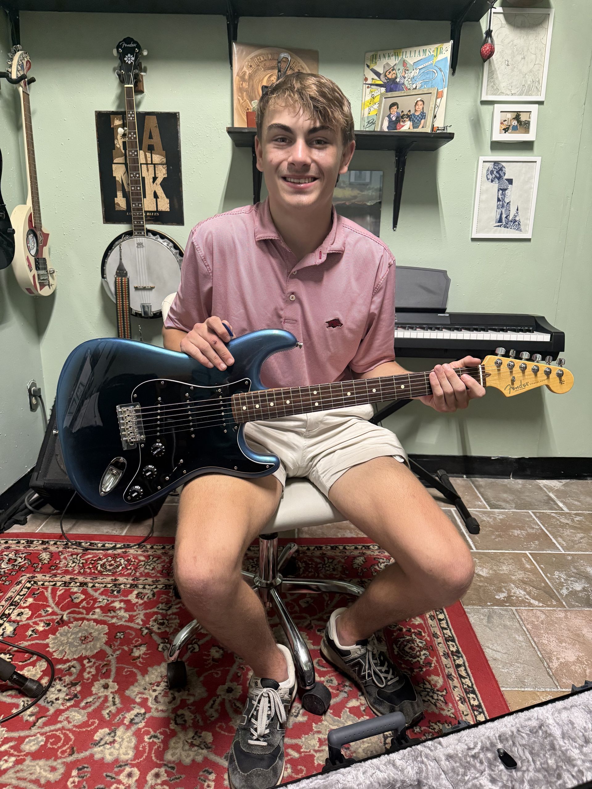 David Dunavant's teaching studio with a student playing the guitar.