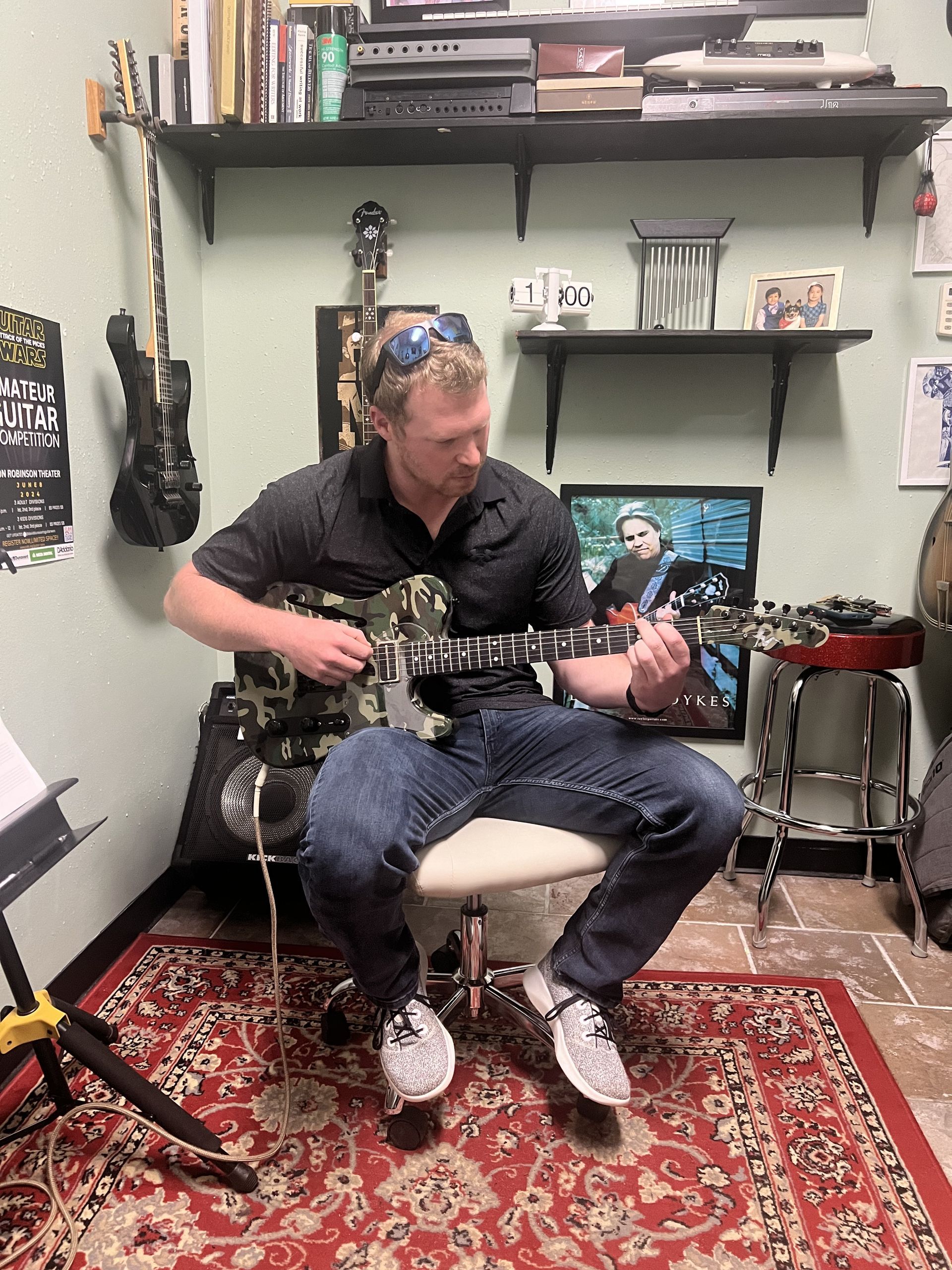 David Dunavant's teaching studio with a student playing the guitar.