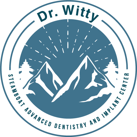 The logo for dr. witty steamboat advanced dentistry and implant center