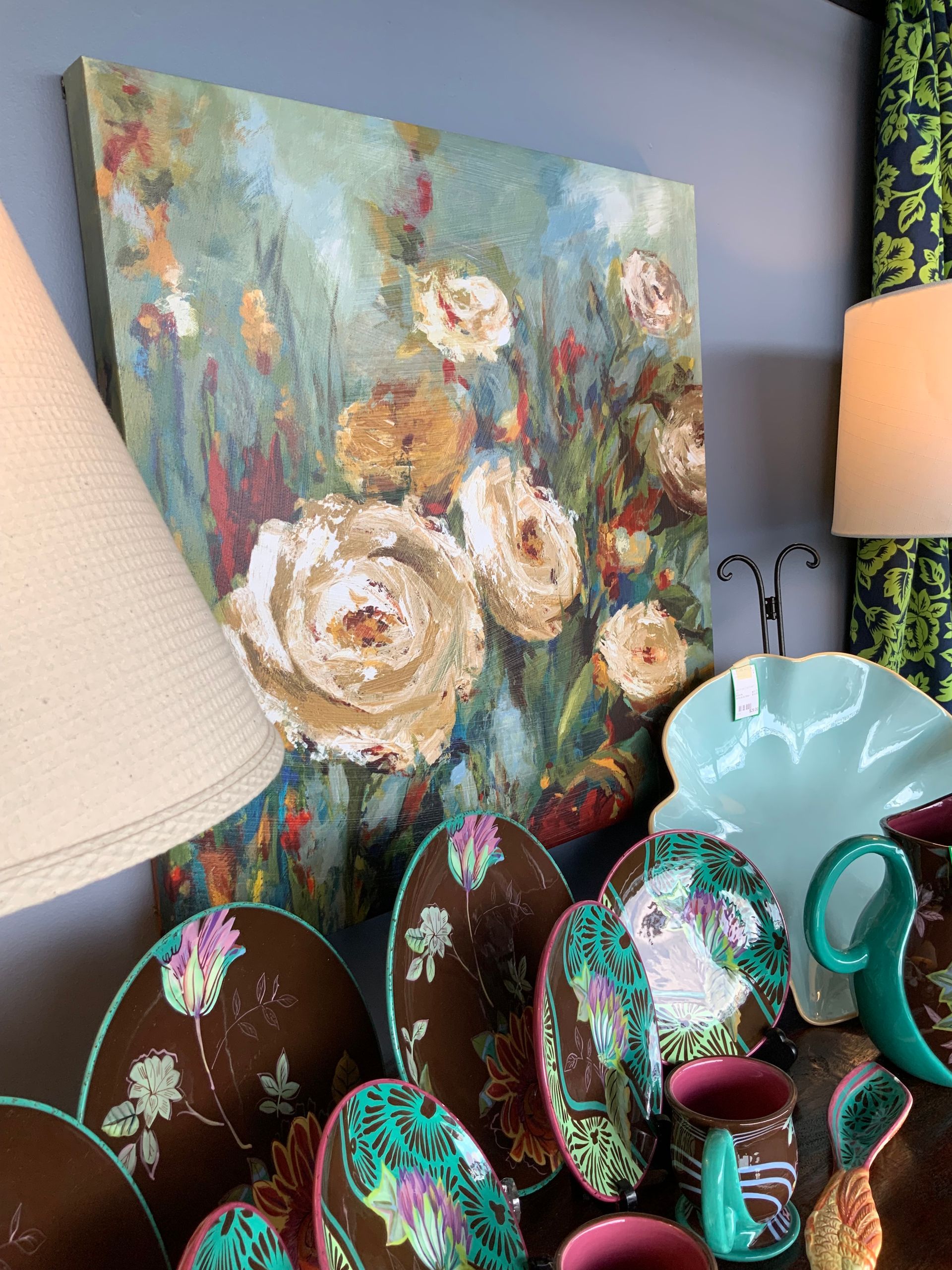 Metal teal succulent wall decor with gold trim.