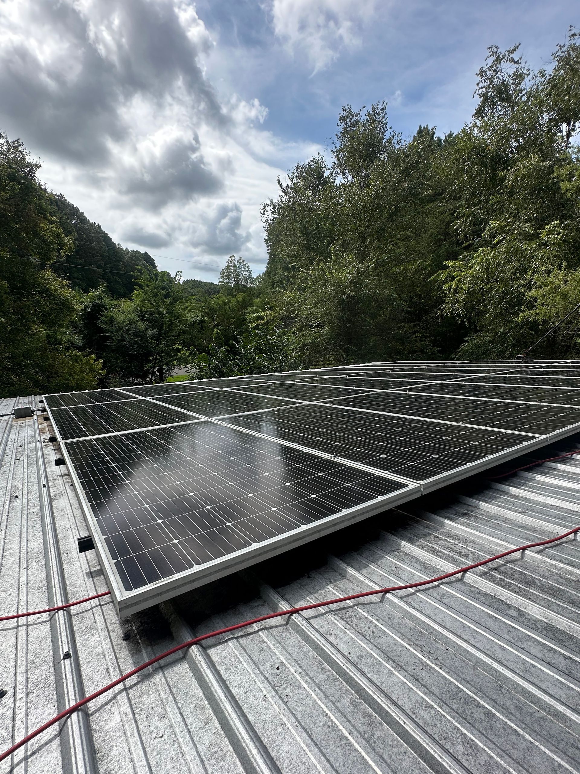 recently cleaned Solar panels on a corrugated metal roof
