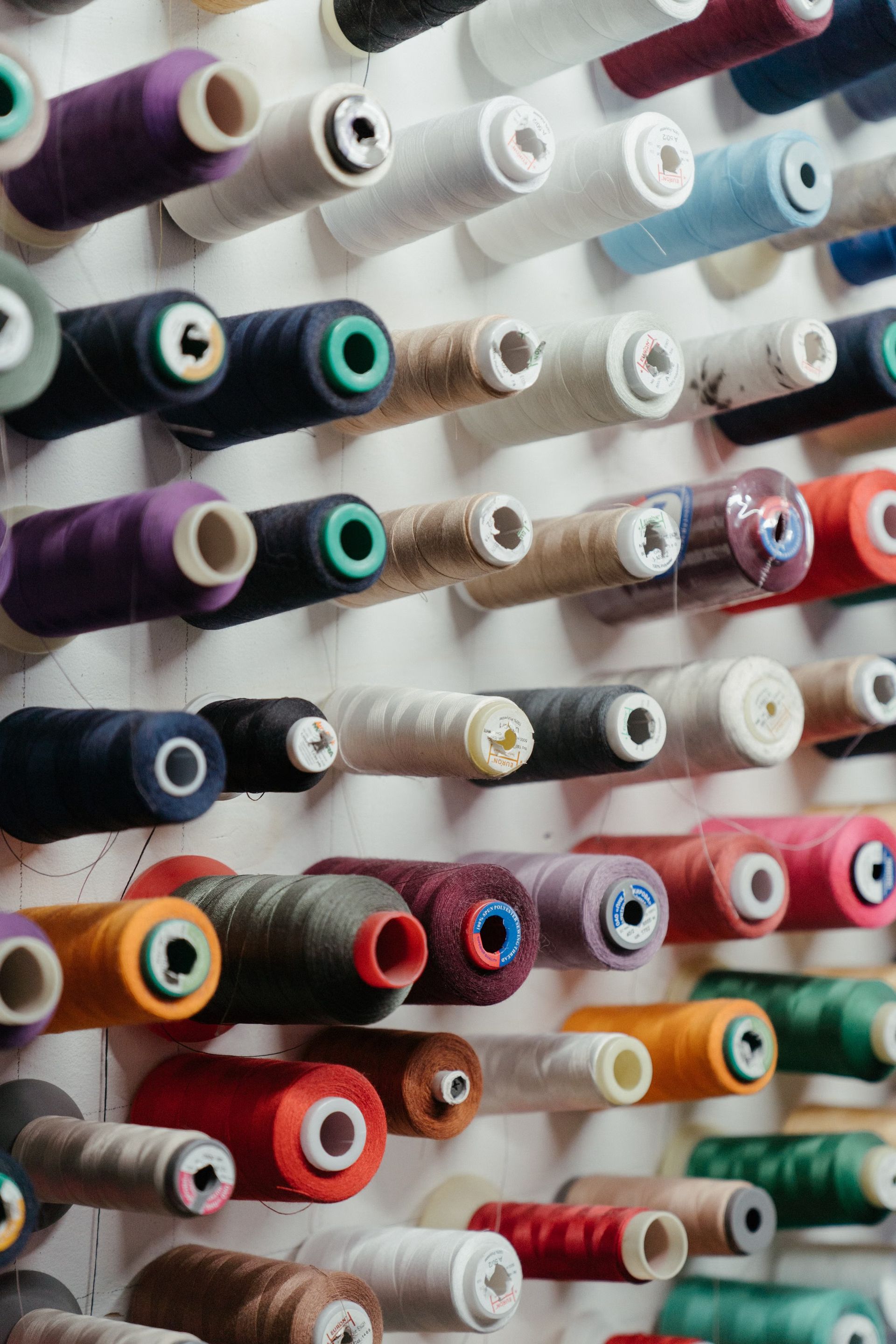 A wall of thread spools in every color