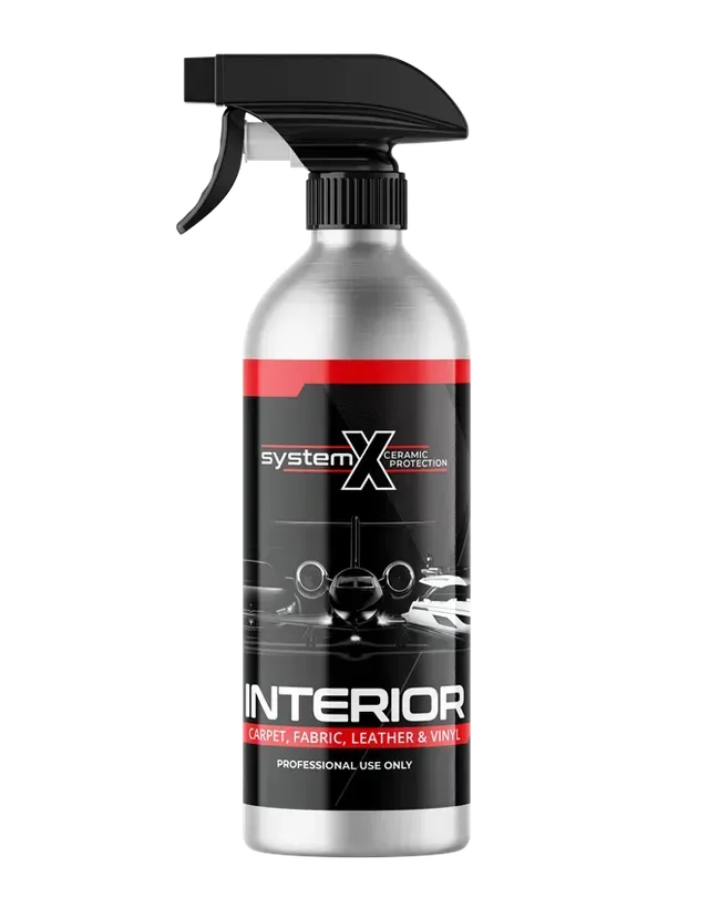 Black spray bottle labeled “INTERIOR” with a red-and-silver design for car interior cleaning