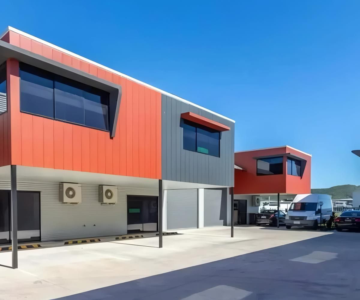 A Row of Buildings With Cars Parked in Front of Them — O'Brien Painting Contractors in Maroochydore, QLD