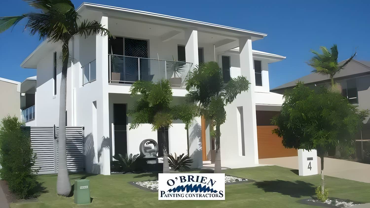 A Big White House and Trees in Front of It — O'Brien Painting Contractors in Alexandra Headland, QLD