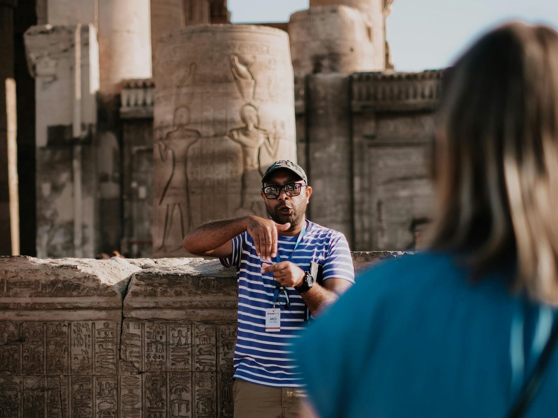 How to Be a Good Tour Leader in Egypt Tour Guide in Egypt: Experienced guide leading tourists through Egypt’s historical sites with cultural insights.