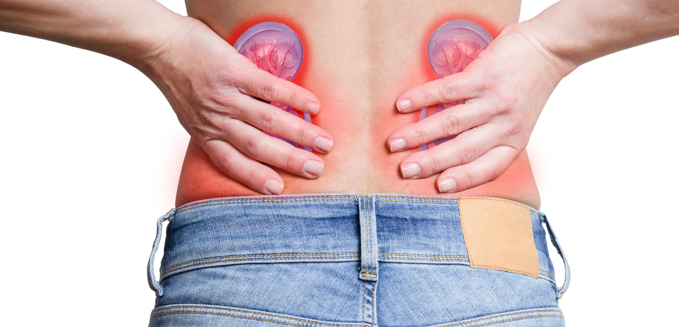 A person is holding their back in pain because of kidney stones.