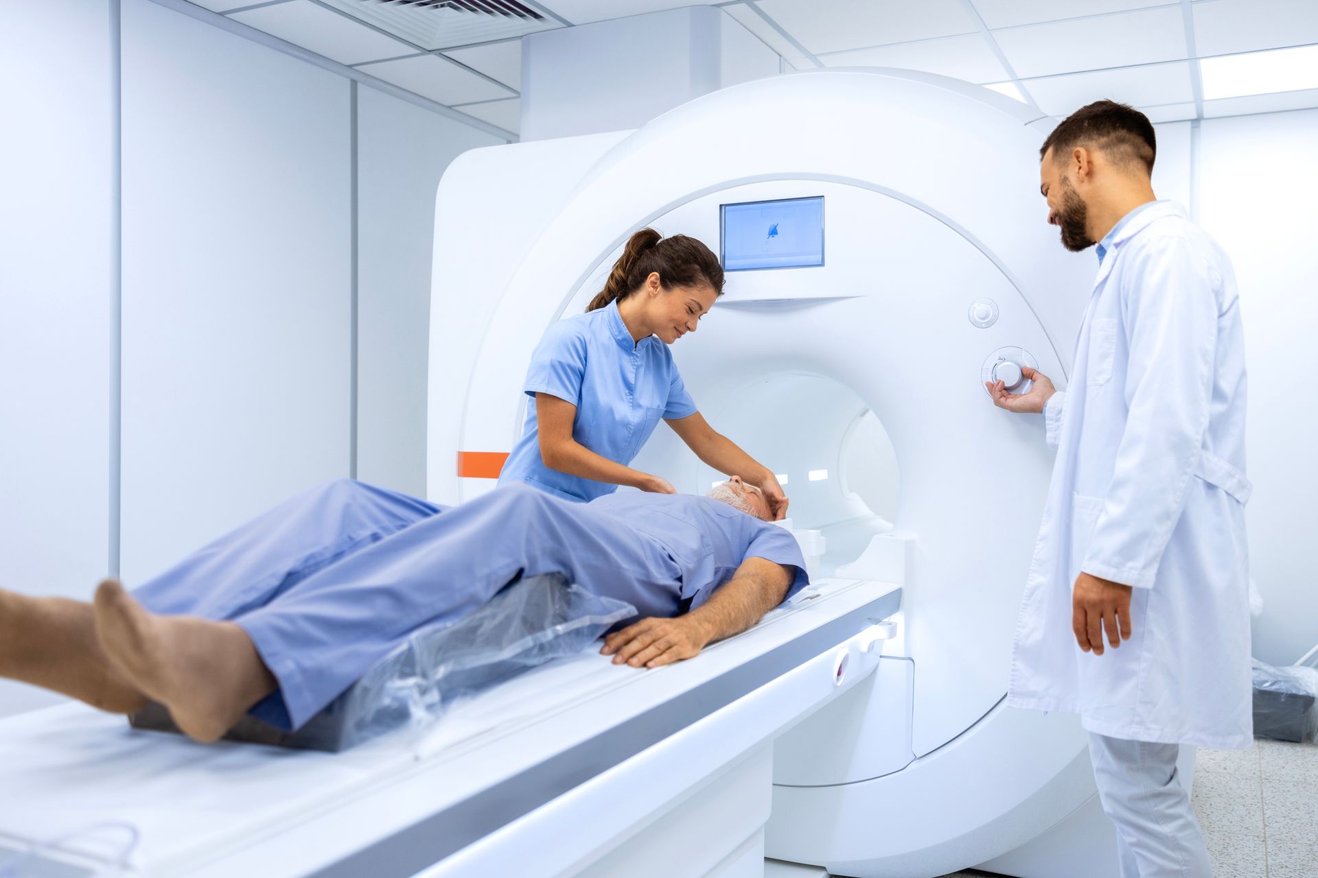 A man is getting an mri scan in a hospital.