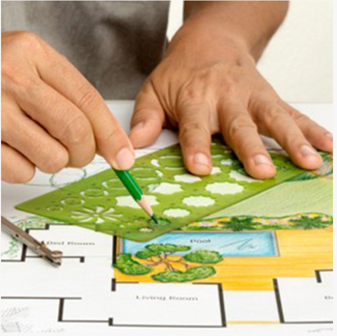 Une personne utilise un pochoir vert et un crayon vert