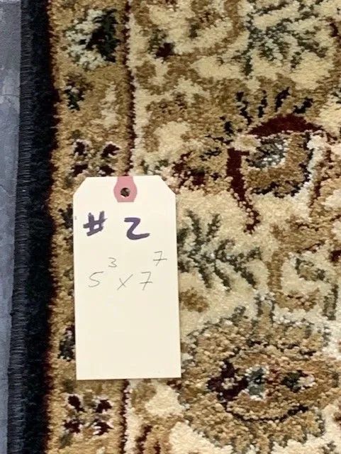A tag on a rug with the number 2 on it