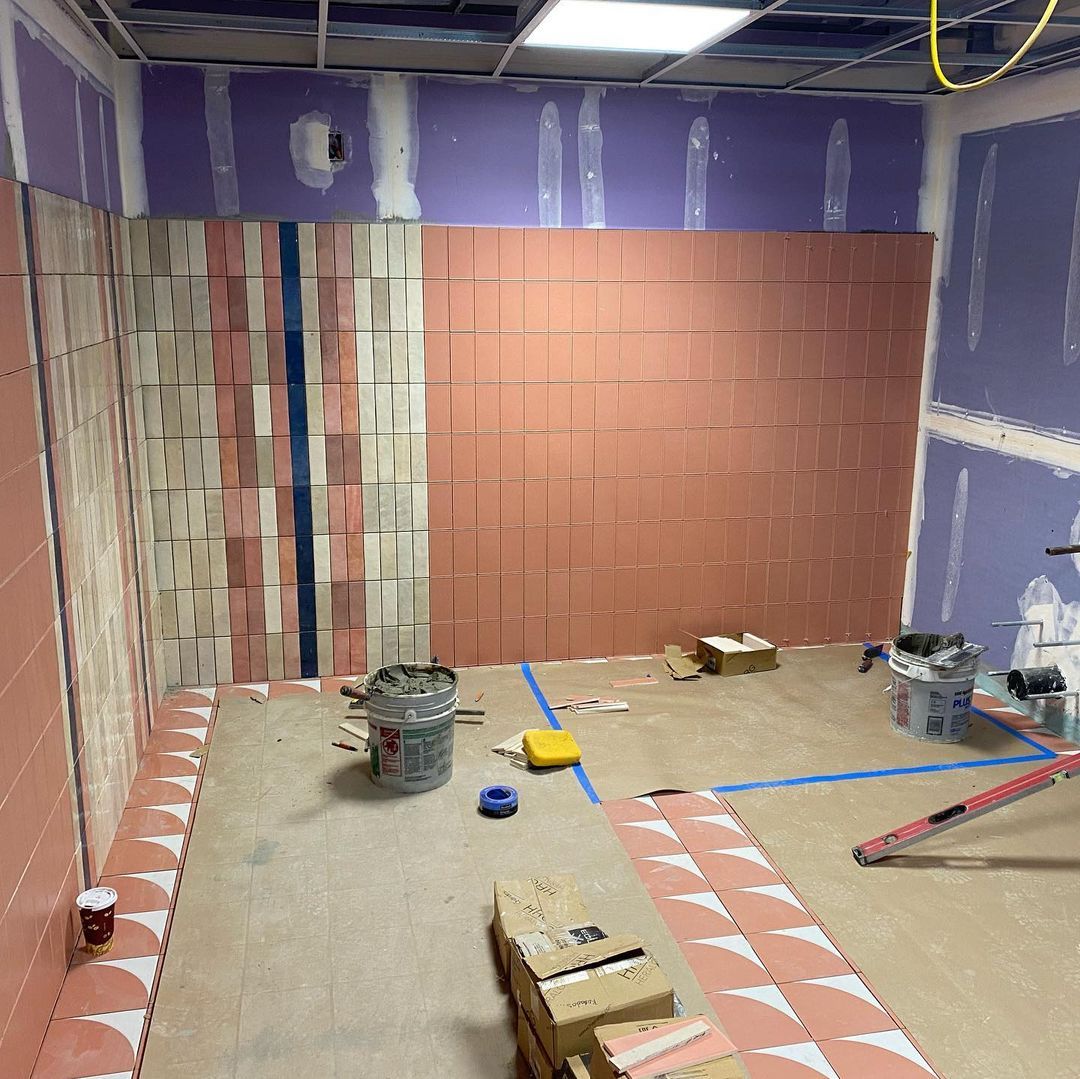 A room that is being remodeled with boxes on the floor