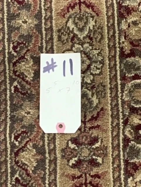 A tag on a rug with the number 11 on it