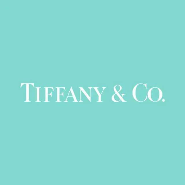 The logo for tiffany & co. is on a light blue background