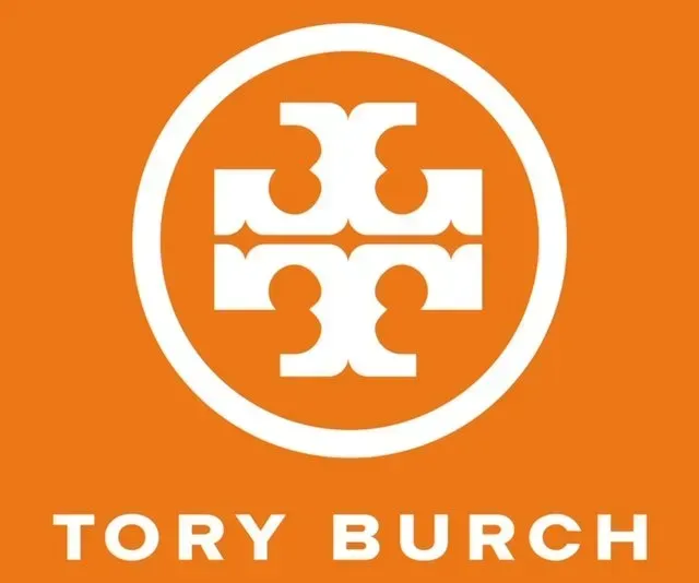 A tory burch logo on an orange background