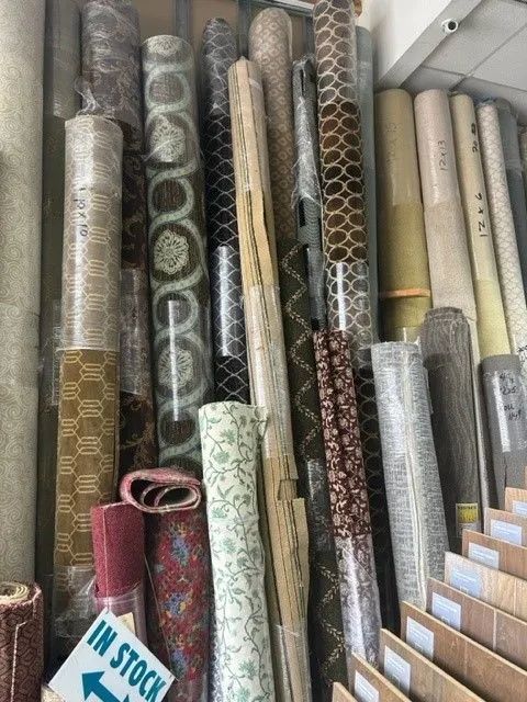A bunch of rolls of carpet are stacked on top of each other