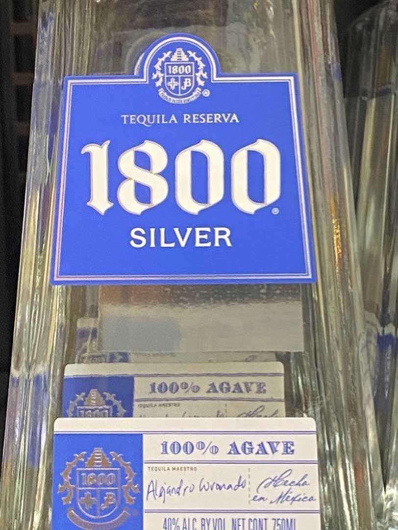 A close up of a bottle of 1800 silver tequila