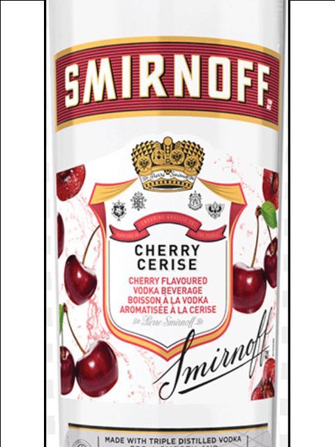A bottle of smirnoff vodka with cherries on the label.