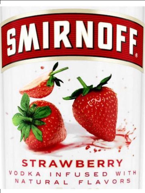 A bottle of smirnoff strawberry vodka infused with natural flavors
