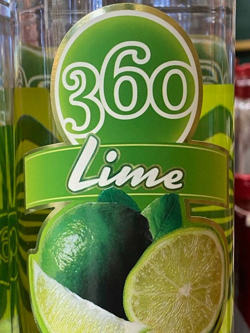 A close up of a bottle of 360 lime juice