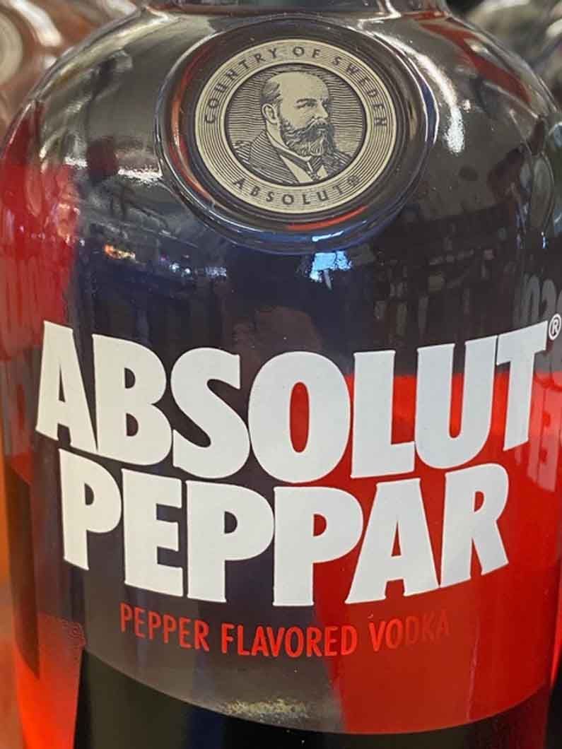 A bottle of absolut peppar pepper flavored vodka