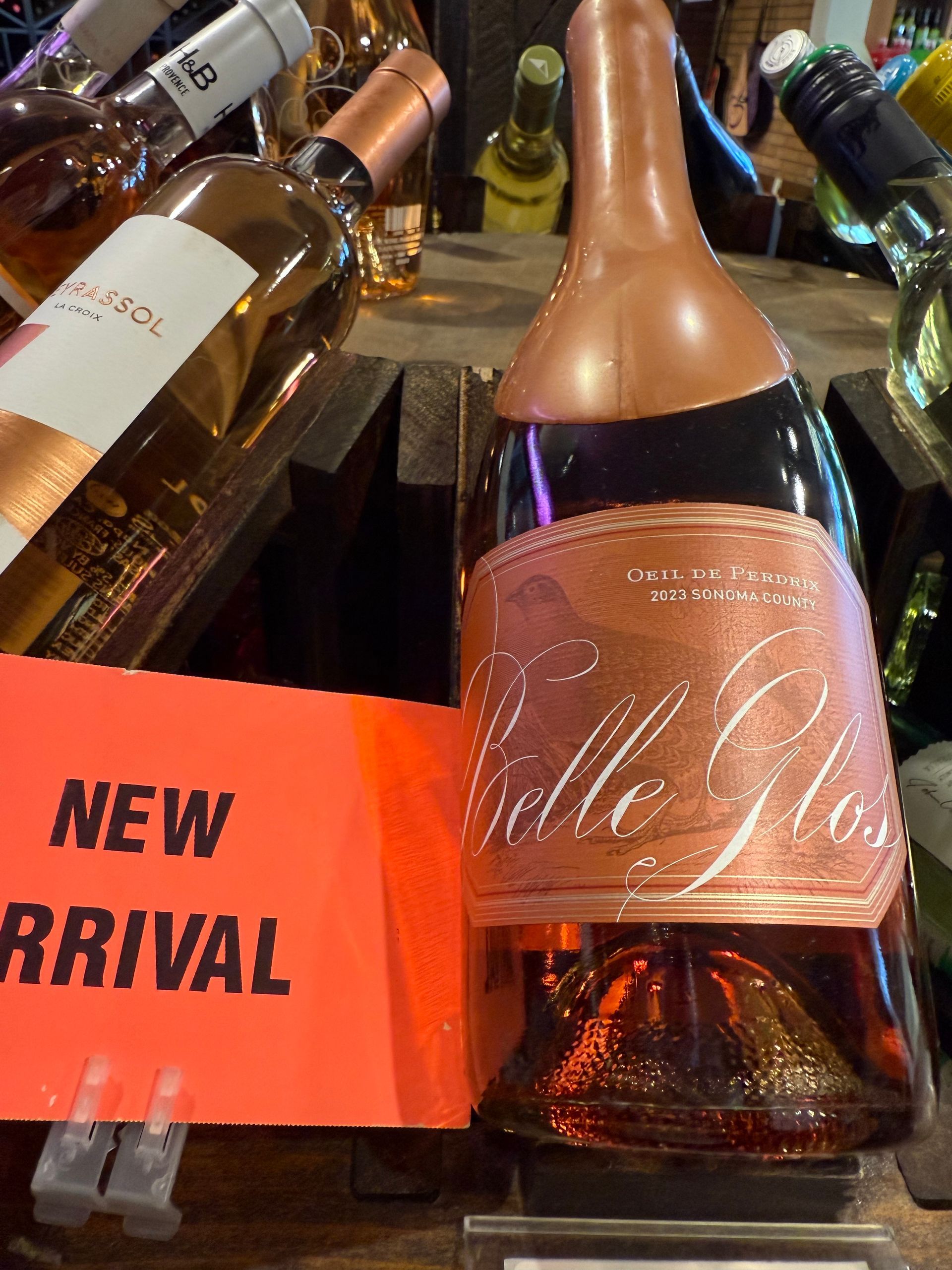 Wine bottles in a shop, including a