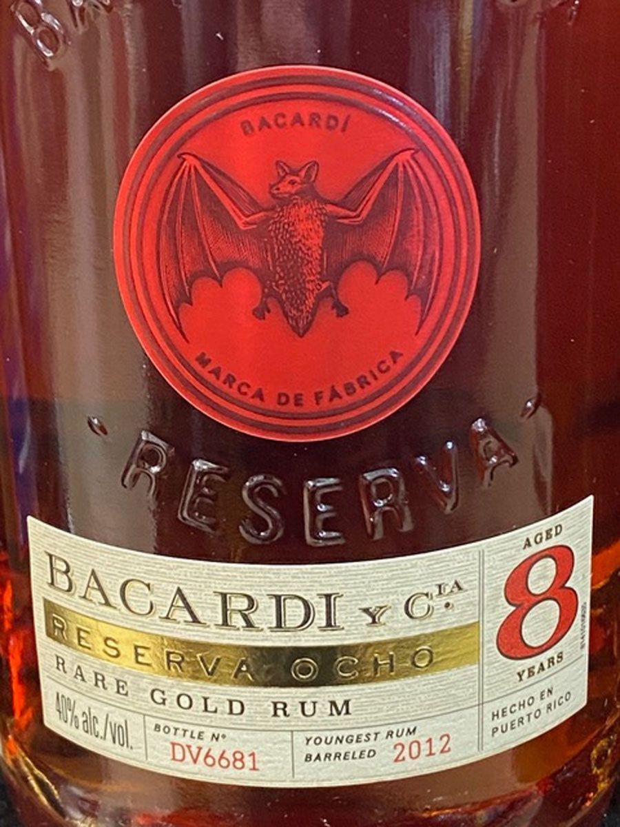 A close up of a bottle of bacardi reserva 8