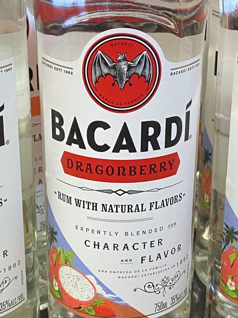 A bottle of bacardi dragonberry rum with natural flavors