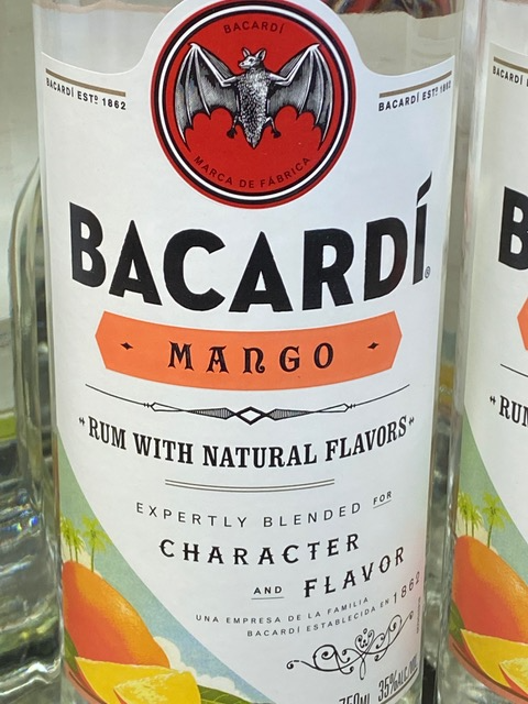 A bottle of bacardi mango rum with natural flavors
