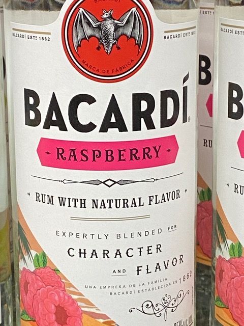 A bottle of bacardi raspberry rum with natural flavor