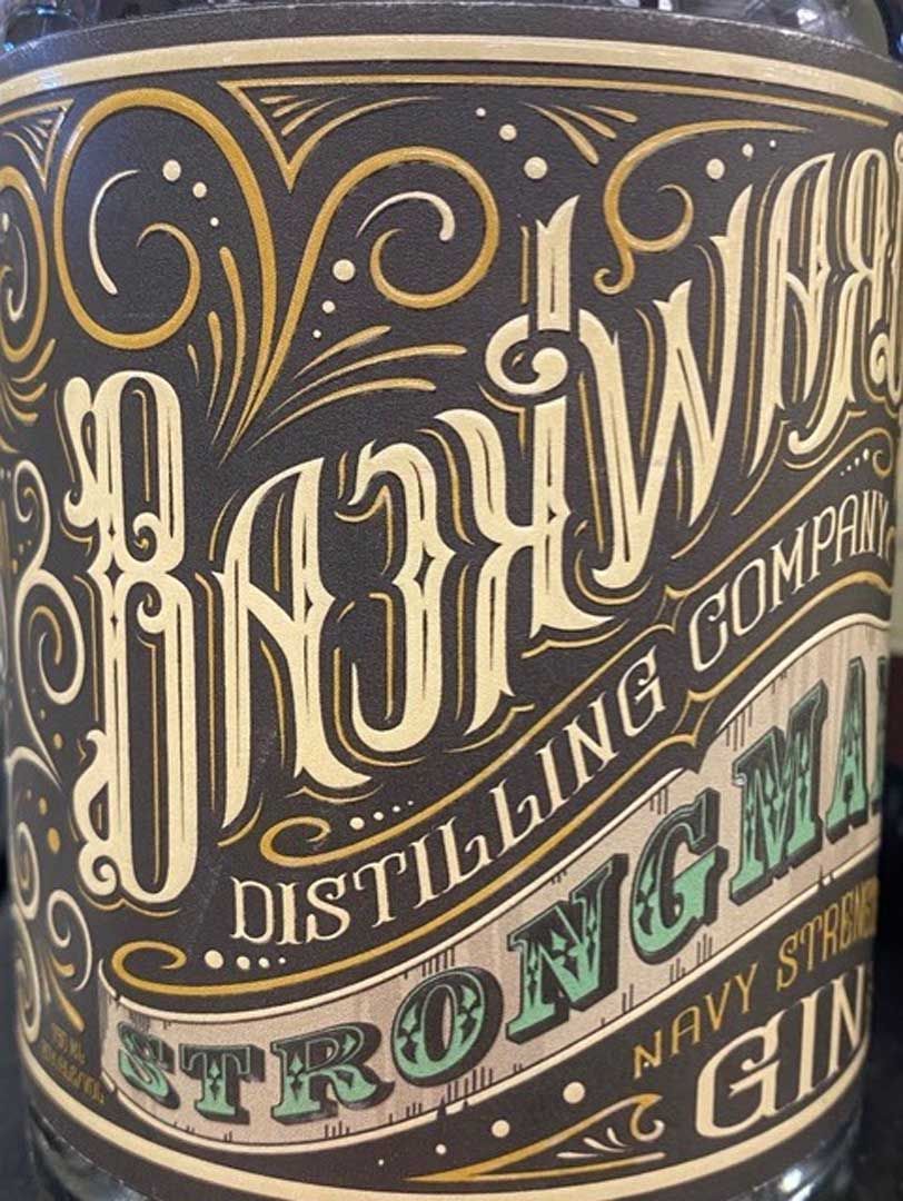 A close up of a bottle of strongman gin