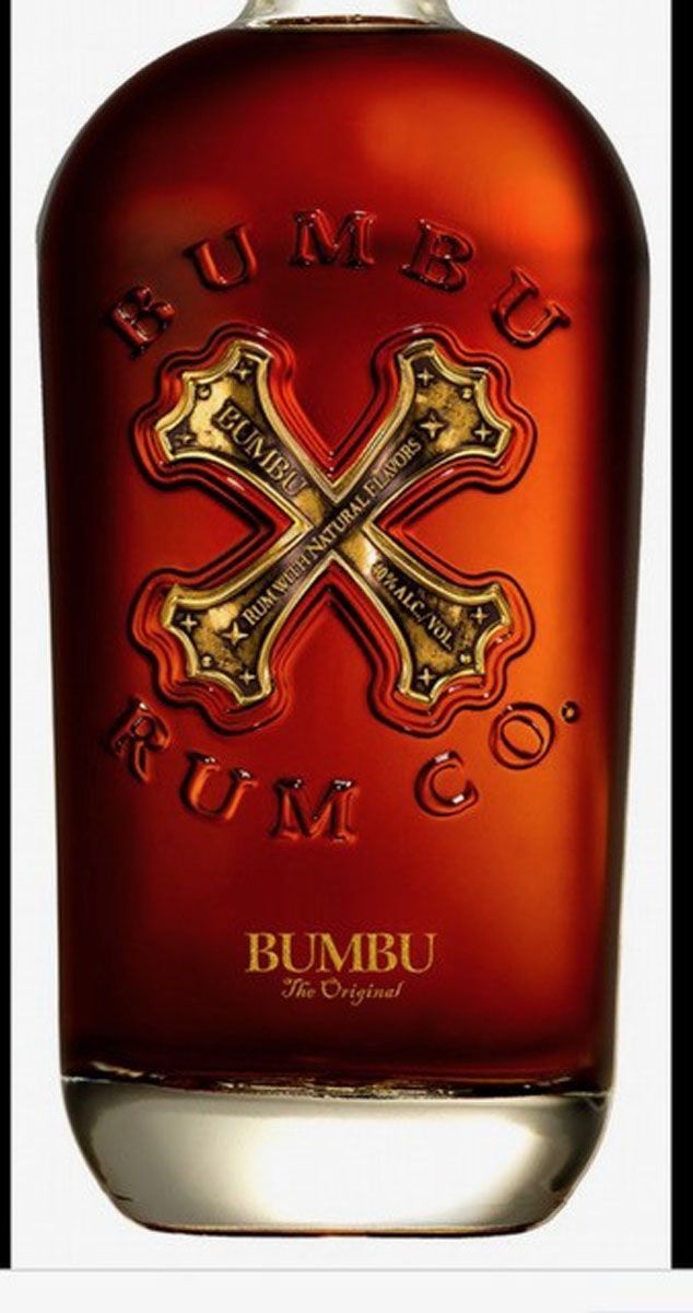 A bottle of bumbu rum with a cross on it