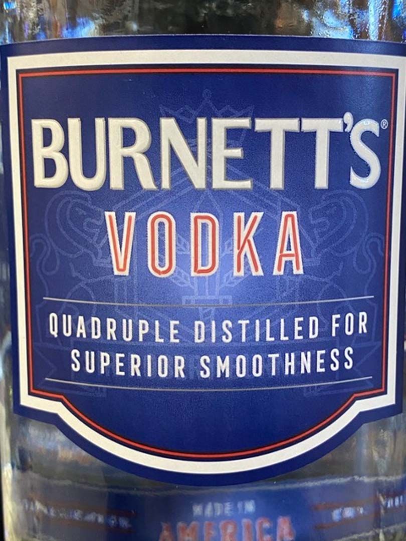 A bottle of burnett 's vodka is quadruple distilled for superior smoothness