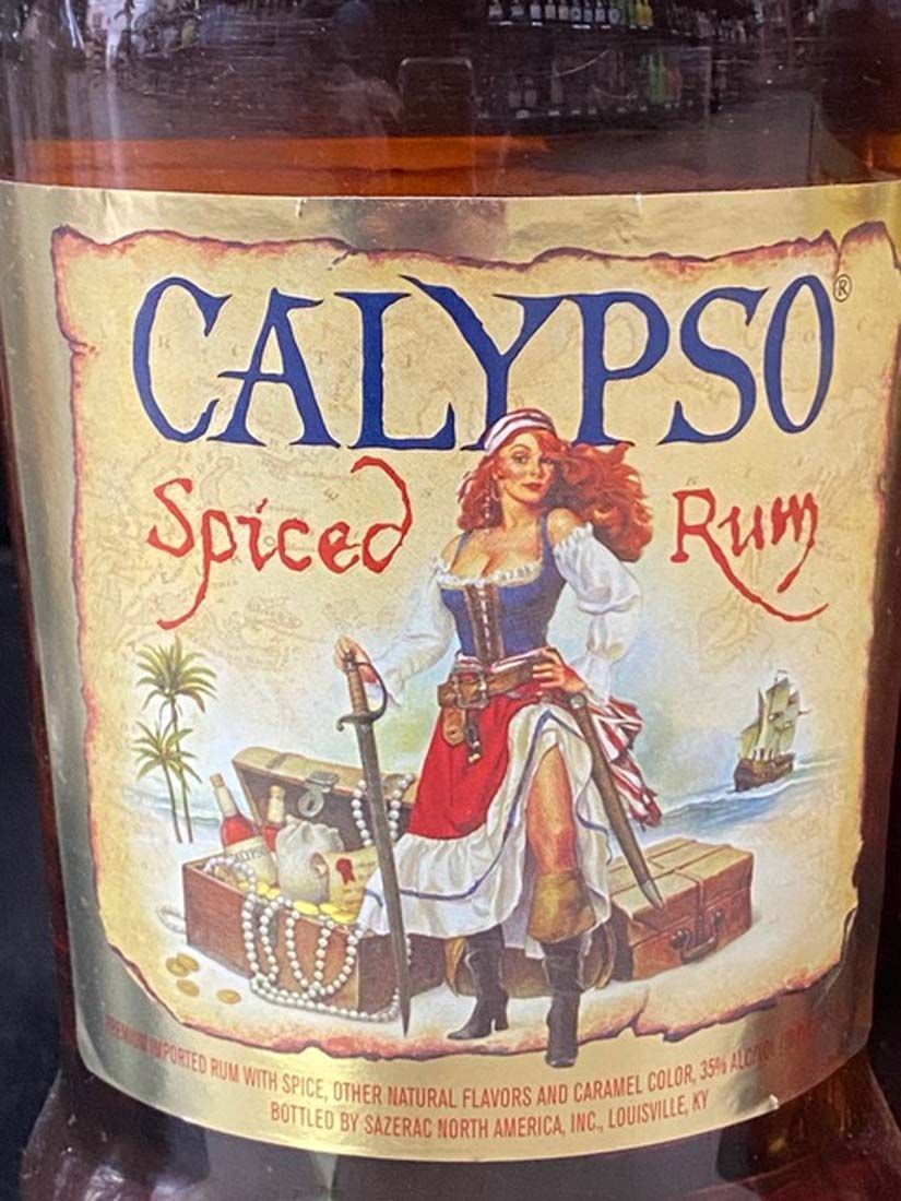 A bottle of calypso spiced rum with a woman on the label