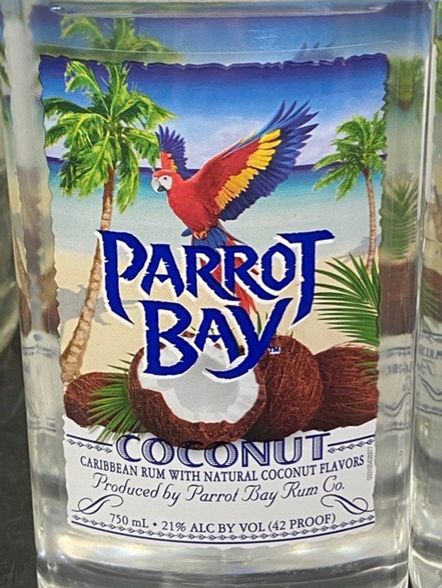 A bottle of parrot bay coconut caribbean rum with natural coconut flavors