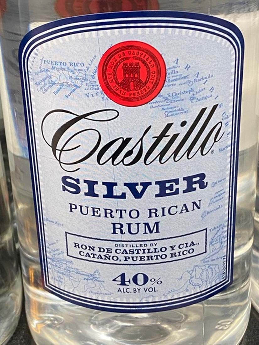 A close up of a bottle of castillo silver puerto rican rum