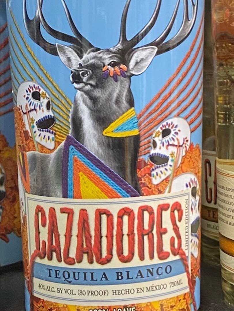 A bottle of cazadores tequila blanco with a deer on the label