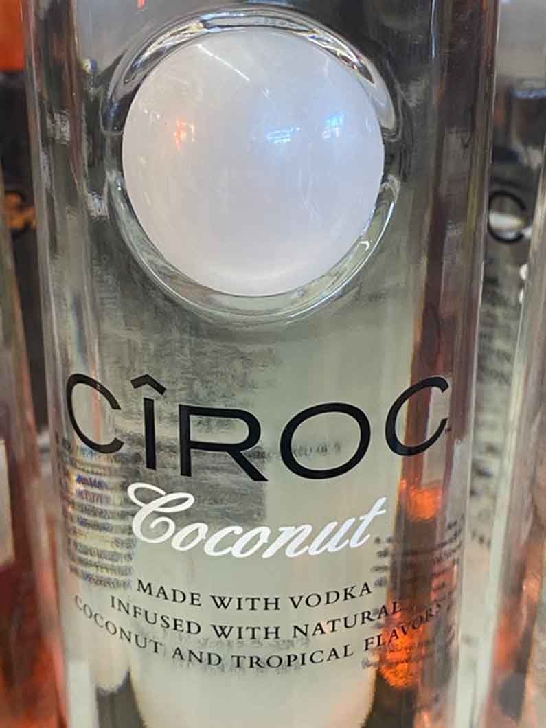 A close up of a bottle of ciroc coconut vodka.