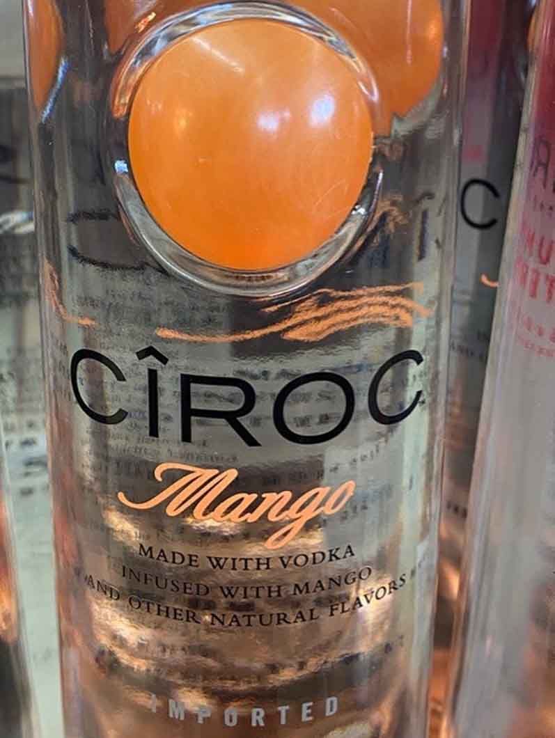 A close up of a bottle of ciroc mango vodka