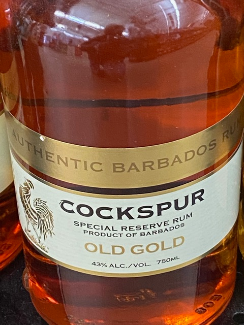 A close up of a bottle of cockspur old gold rum