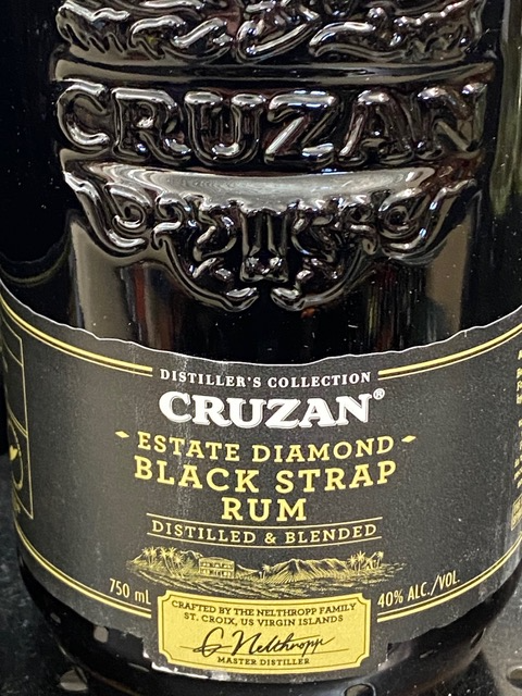 A bottle of cruzan estate diamond black strap rum
