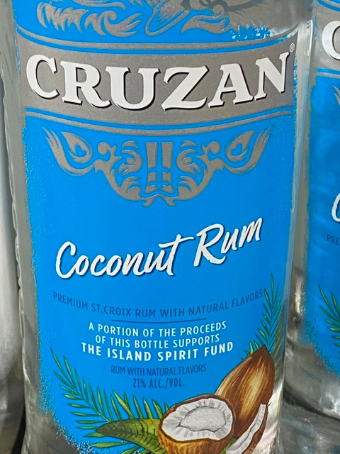 A bottle of cruzan coconut rum with a coconut on the label