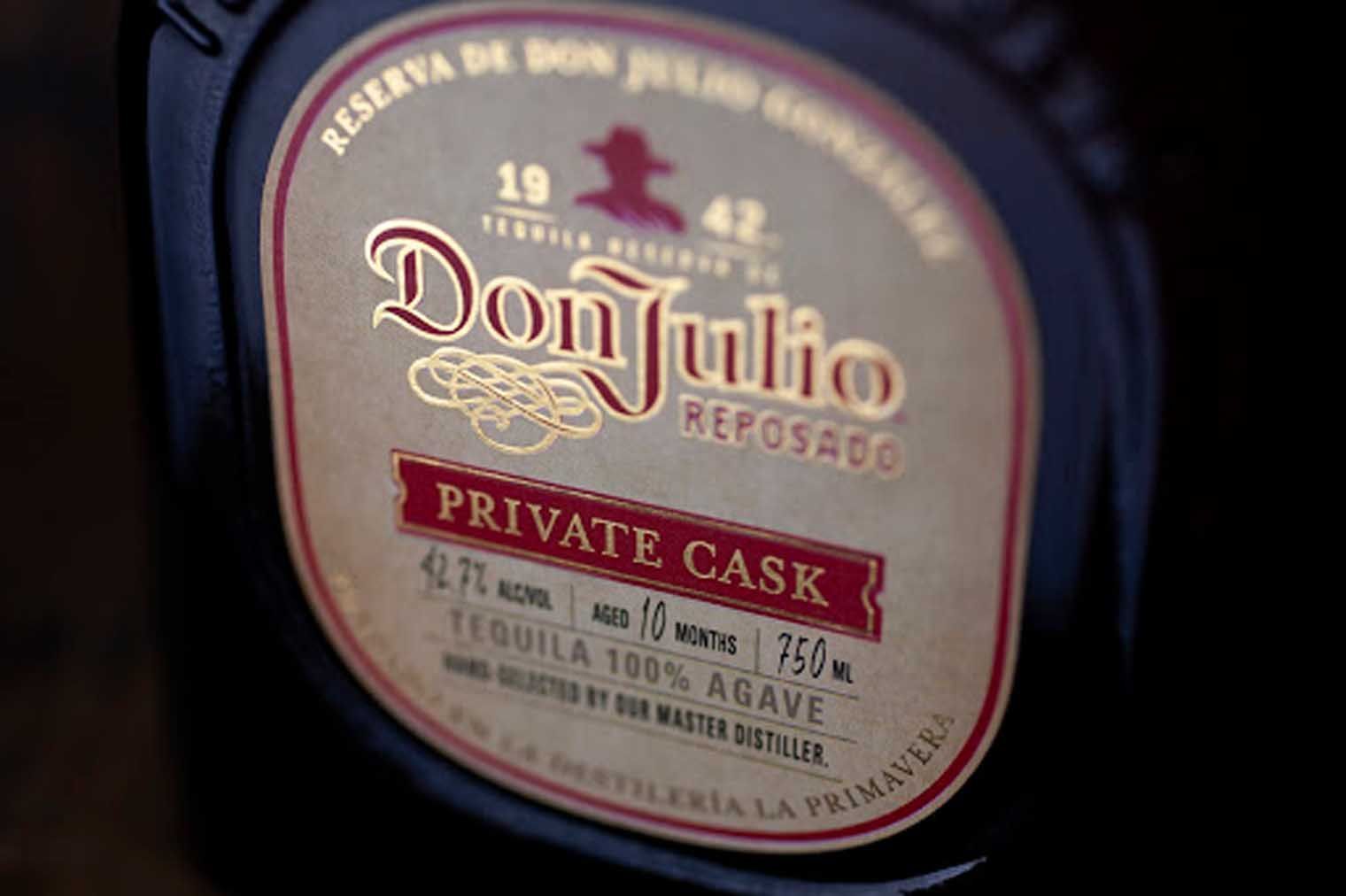 A close up of a bottle of don julio tequila