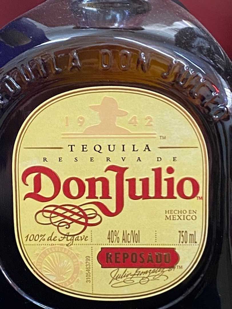 A close up of a bottle of don julio tequila