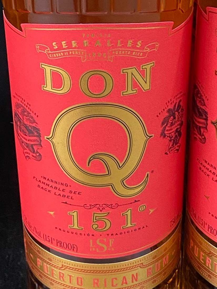 A close up of a bottle of don 151 rum