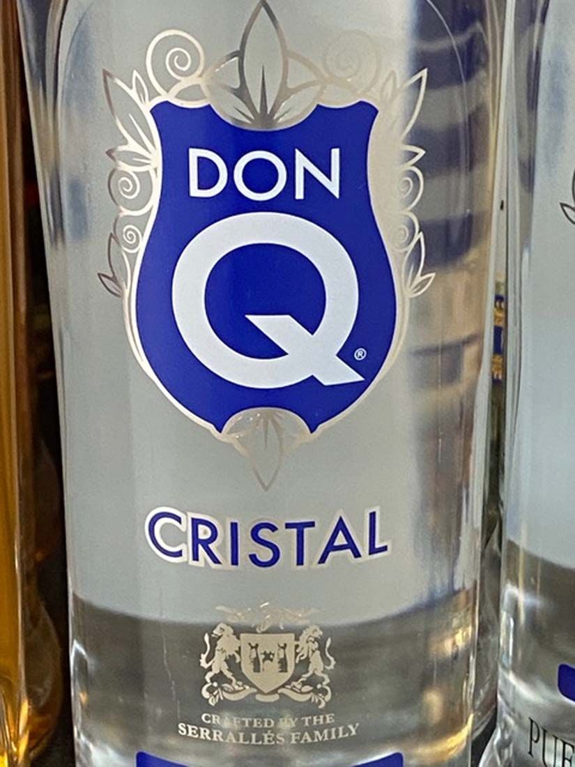 A close up of a bottle of don q cristal vodka