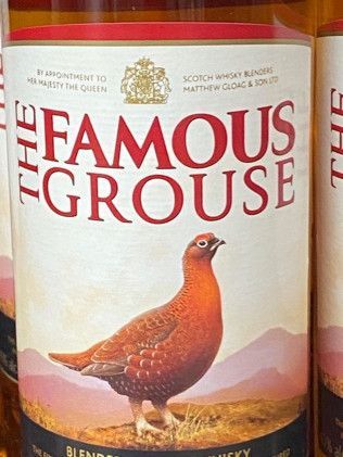 A bottle of the famous grouse scotch whisky with a bird on the label.